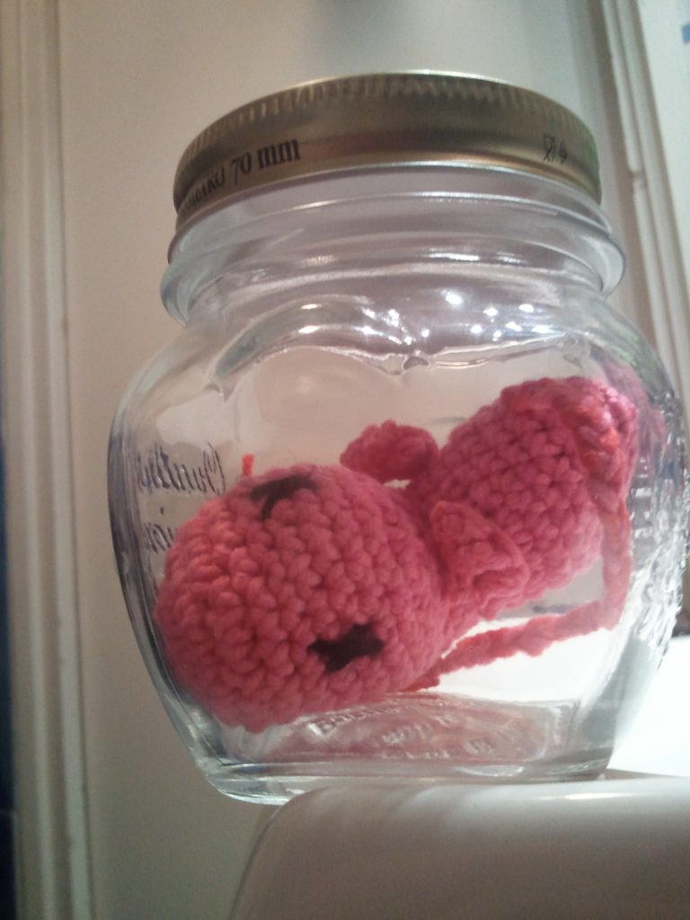 crochet amigurumi fetus in a jar